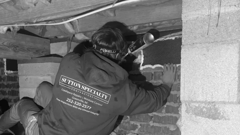 working underneath house - Choose the Right Crawlspace & Foundation Repair Company blog